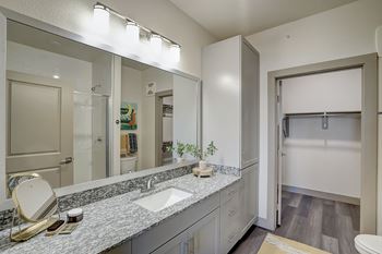 Upgraded tile in bathrooms & framed bathroom mirrors